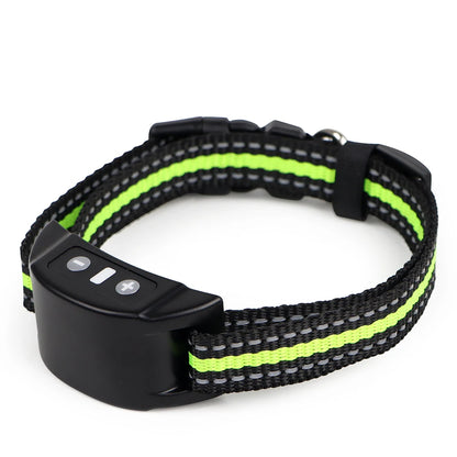 Black and green dog collar with electronic device on a white background